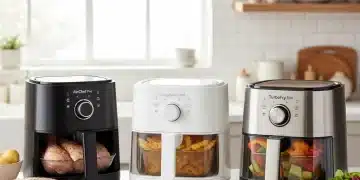 Three modern air fryers on a kitchen counter with fresh ingredients, ready for cooking.